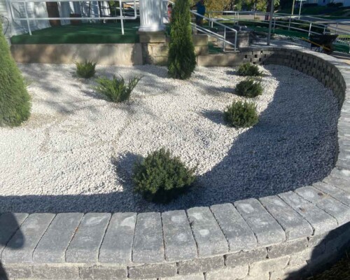 Curved-stone-wall-with-rock